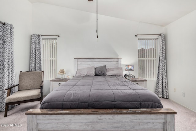 bedroom featuring carpet and vaulted ceiling