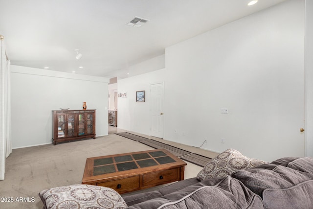 living room featuring recessed lighting, light carpet, and visible vents