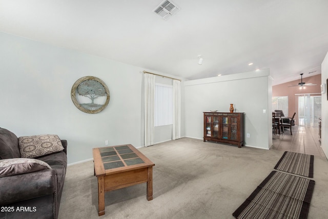 carpeted living room featuring recessed lighting, visible vents, vaulted ceiling, and baseboards