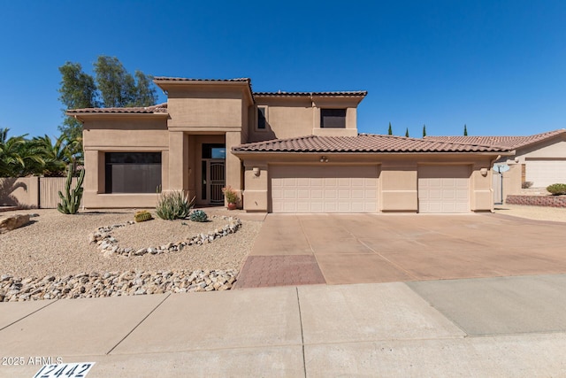 view of front facade featuring an attached garage, fence, driveway, a tiled roof, and stucco siding