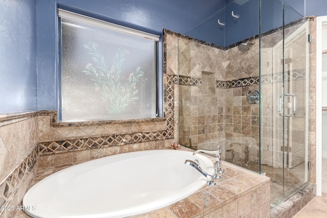 full bathroom with a garden tub and a shower stall