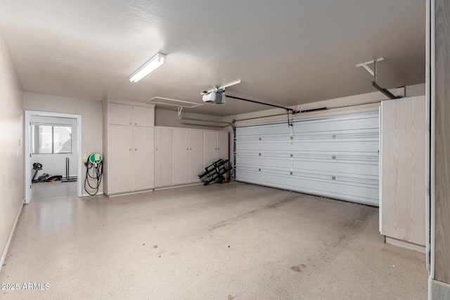 garage featuring a garage door opener