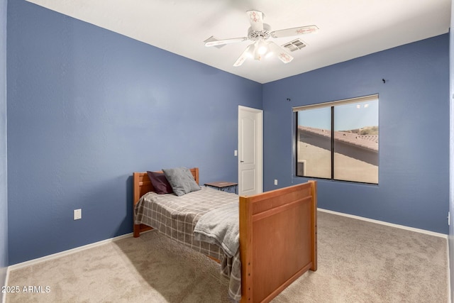 bedroom with light carpet, baseboards, visible vents, and ceiling fan