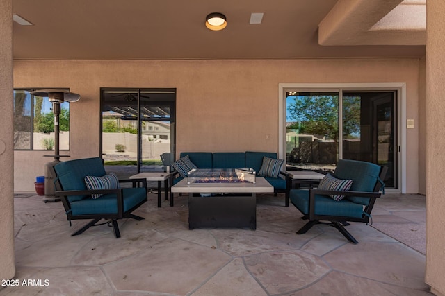 view of patio / terrace featuring an outdoor living space with a fire pit