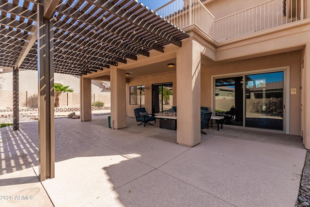 view of patio featuring fence, an outdoor living space, and a pergola