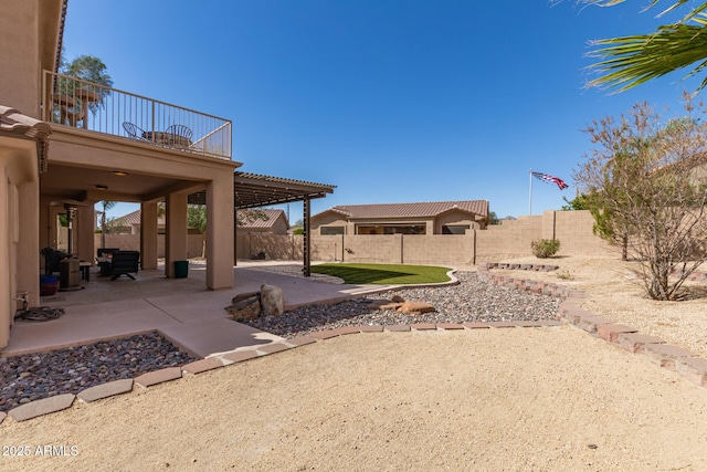 view of yard featuring a patio area and a fenced backyard