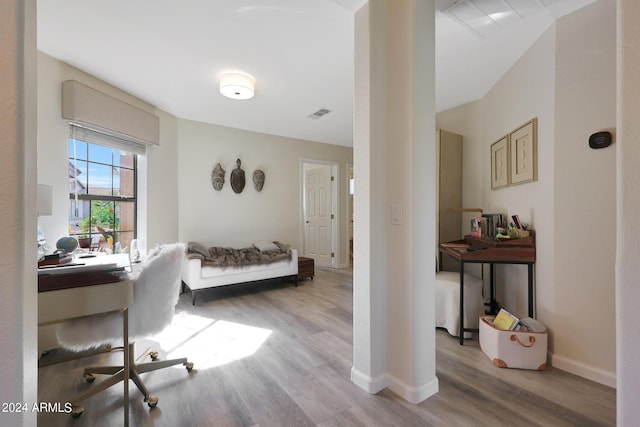 office with light wood-type flooring