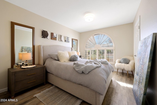 bedroom featuring dark hardwood / wood-style flooring