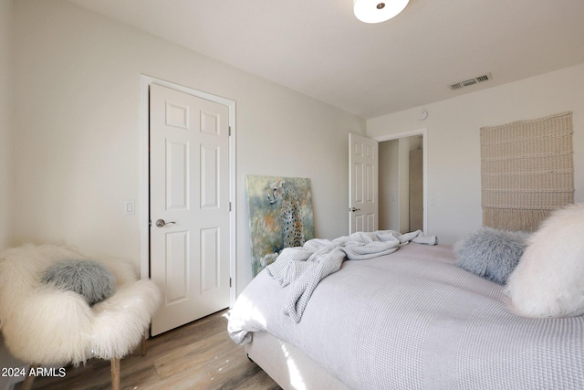 bedroom featuring hardwood / wood-style floors