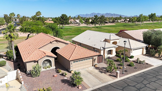 birds eye view of property with a mountain view