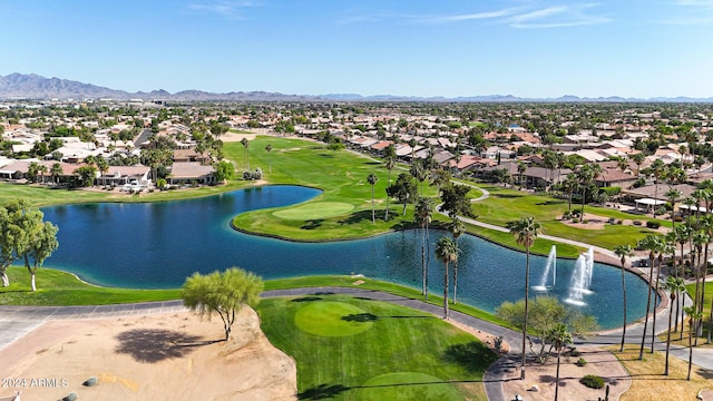 birds eye view of property with a water and mountain view