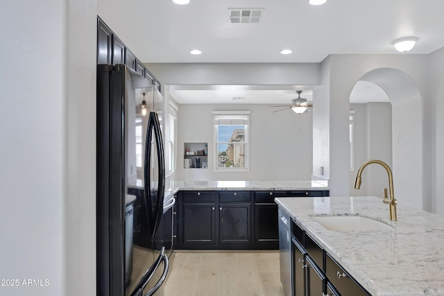 3687 E Leslie Dr, Gilbert, AZ 85296 - kitchen featuring a sink, freestanding refrigerator, light wood-style floors, stainless steel dishwasher, and ceiling fan