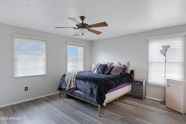 3687 E Leslie Dr, Gilbert, AZ 85296 - bedroom featuring wood finished floors, refrigerator, baseboards, and a ceiling fan