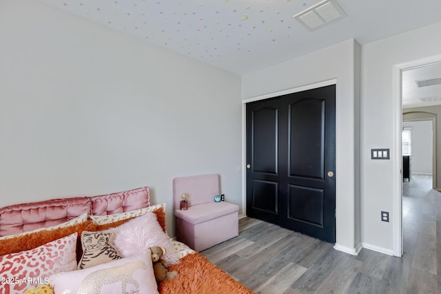 3687 E Leslie Dr, Gilbert, AZ 85296 - bedroom featuring wood finished floors, baseboards, and a closet