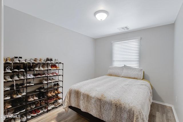 3687 E Leslie Dr, Gilbert, AZ 85296 - bedroom with wood finished floors and baseboards