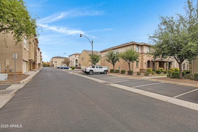 3687 E Leslie Dr, Gilbert, AZ 85296 - view of asphalt street with a residential view, street lighting, and curbs