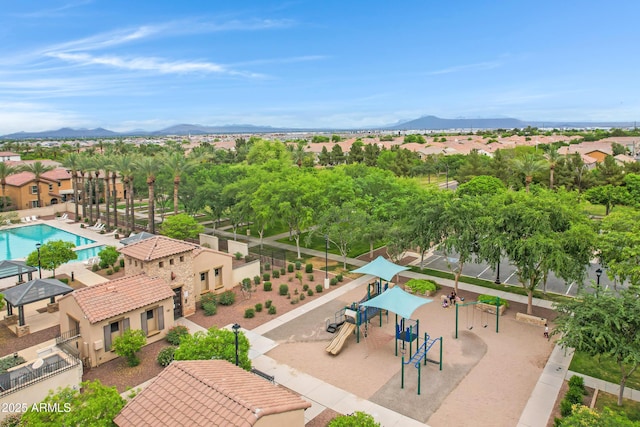 3687 E Leslie Dr, Gilbert, AZ 85296 - aerial view of residential area featuring a mountain backdrop and a pool area