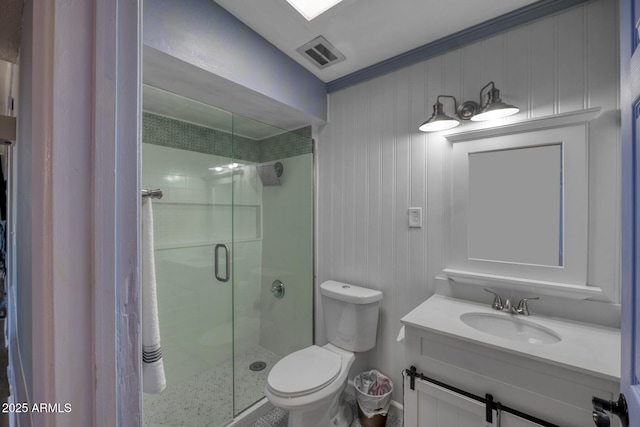 full bathroom featuring visible vents, toilet, a shower stall, and vanity