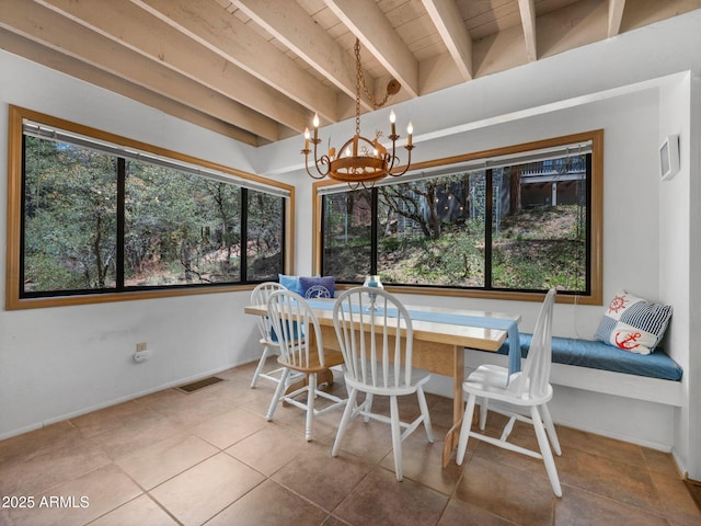 4567 N Juniper Ln, Pine, AZ 85544 - tiled dining room featuring beam ceiling, a chandelier, and baseboards