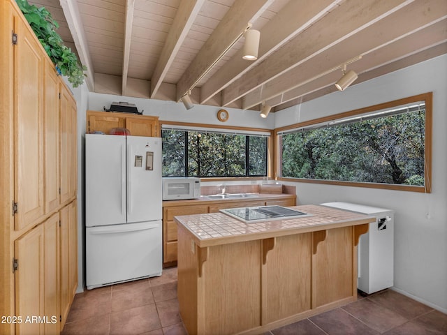 4567 N Juniper Ln, Pine, AZ 85544 - kitchen with white appliances, tile counters, a sink, light tile patterned flooring, and a kitchen bar