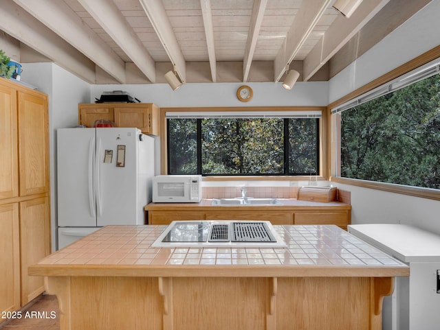 4567 N Juniper Ln, Pine, AZ 85544 - kitchen with tile counters, white appliances, a sink, a center island, and wooden ceiling with exposed beams