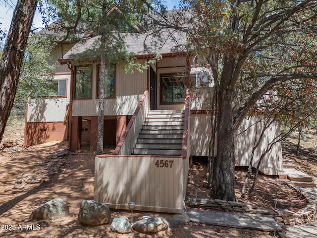 4567 N Juniper Ln, Pine, AZ 85544 - view of front facade with stairway and roof with shingles