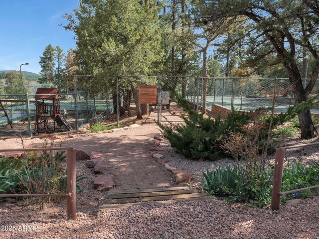 4567 N Juniper Ln, Pine, AZ 85544 - view of tennis court with a gate