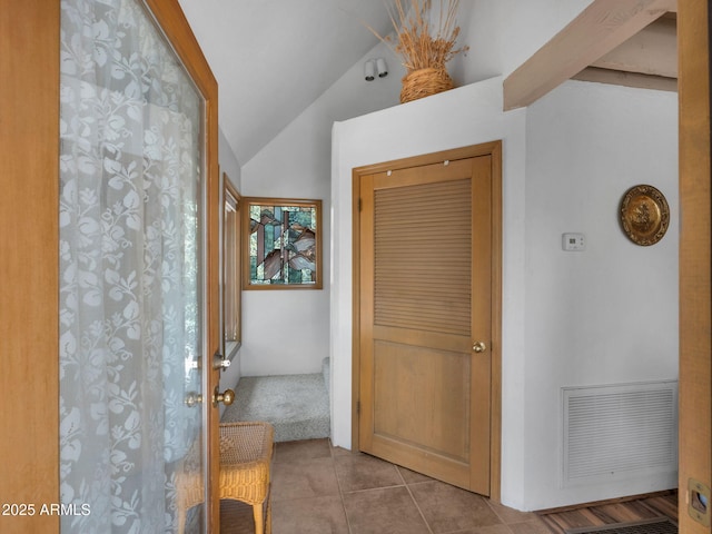 4567 N Juniper Ln, Pine, AZ 85544 - hallway featuring vaulted ceiling and tile patterned floors