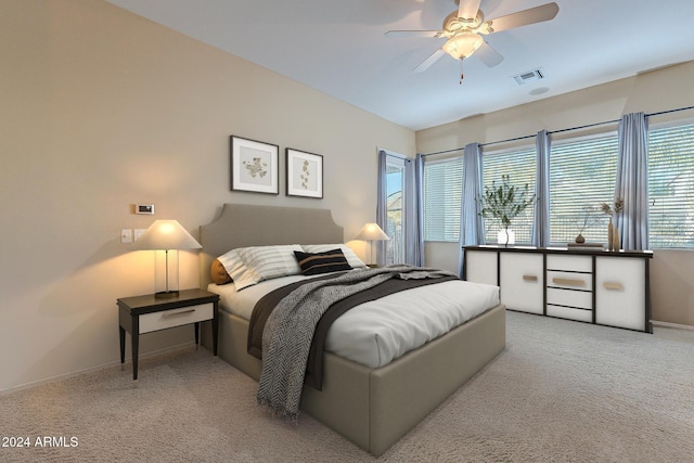 bedroom with light carpet and ceiling fan