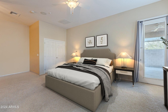 carpeted bedroom featuring access to outside, a closet, and ceiling fan