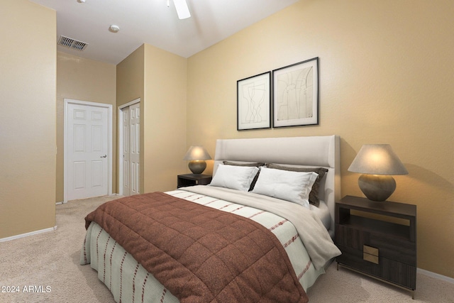 bedroom featuring light carpet, a closet, and ceiling fan