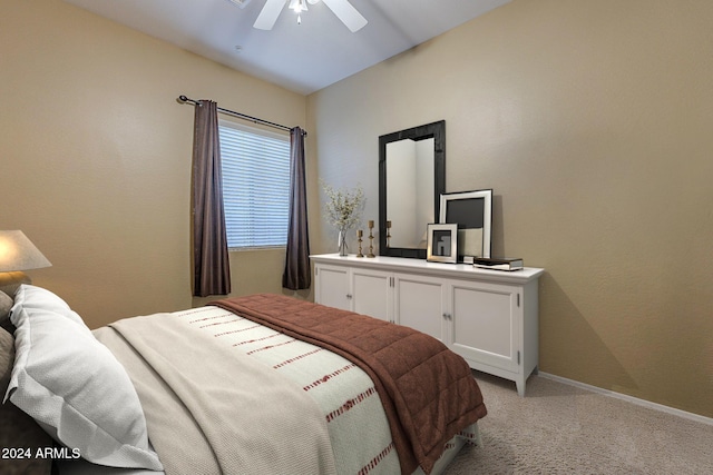 carpeted bedroom featuring vaulted ceiling and ceiling fan