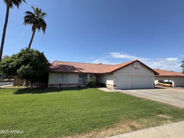 single story home featuring a garage, a front lawn, driveway, and stucco siding