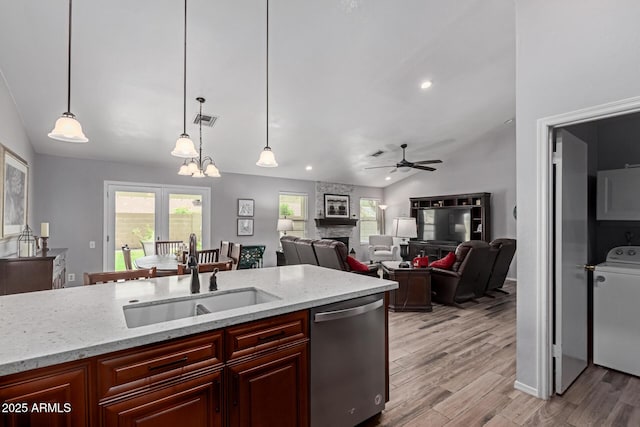 19 W Wickieup Ln, Phoenix, AZ 85027 - kitchen featuring dishwasher, a sink, vaulted ceiling, light wood-style flooring, and healthy amount of natural light