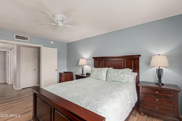19 W Wickieup Ln, Phoenix, AZ 85027 - bedroom featuring light wood-style floors, a closet, baseboards, and a ceiling fan