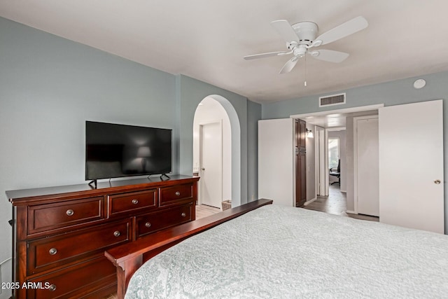 19 W Wickieup Ln, Phoenix, AZ 85027 - bedroom with arched walkways and a ceiling fan