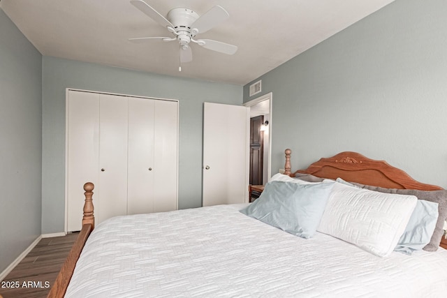19 W Wickieup Ln, Phoenix, AZ 85027 - bedroom featuring wood finished floors, a closet, baseboards, and a ceiling fan