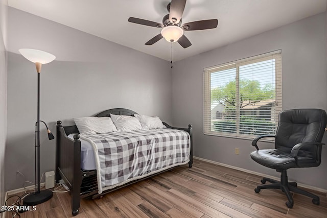 19 W Wickieup Ln, Phoenix, AZ 85027 - bedroom featuring wood finished floors, baseboards, a ceiling fan, and lofted ceiling