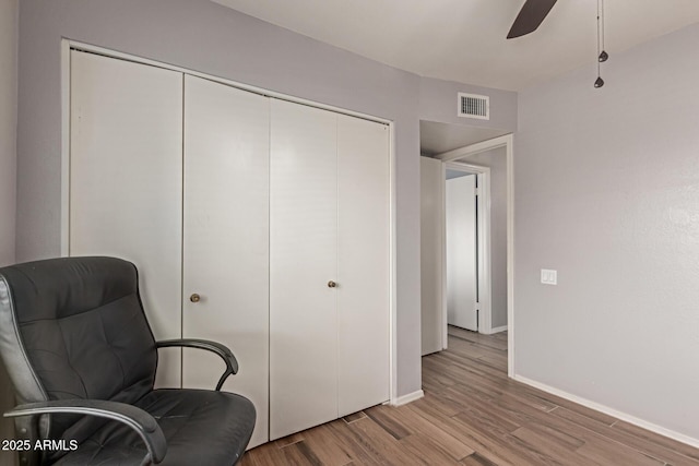 19 W Wickieup Ln, Phoenix, AZ 85027 - living area featuring light wood-type flooring, baseboards, and a ceiling fan