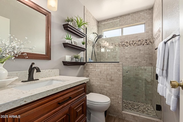 19 W Wickieup Ln, Phoenix, AZ 85027 - full bathroom with vanity, tiled shower, and toilet