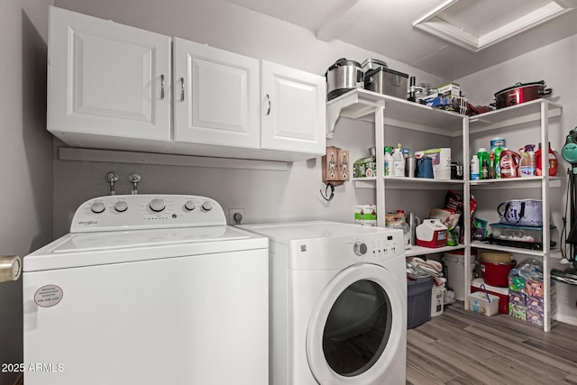 19 W Wickieup Ln, Phoenix, AZ 85027 - washroom featuring washer and clothes dryer, cabinet space, wood finished floors, and attic access