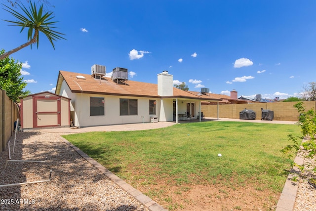 19 W Wickieup Ln, Phoenix, AZ 85027 - back of house with a patio, a chimney, and cooling unit