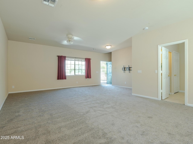 2826 E Tracy Ln Unit 3, Phoenix, AZ 85032 - unfurnished room with light colored carpet, baseboards, and a ceiling fan