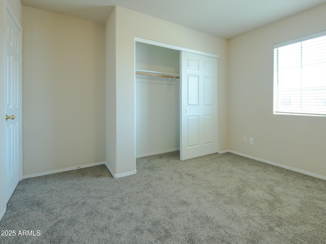 2826 E Tracy Ln Unit 3, Phoenix, AZ 85032 - unfurnished bedroom featuring carpet, a closet, and baseboards