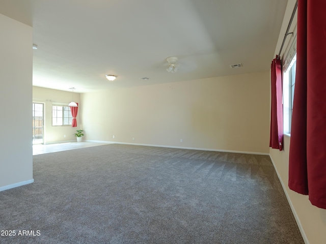 2826 E Tracy Ln Unit 3, Phoenix, AZ 85032 - carpeted spare room with baseboards and a ceiling fan