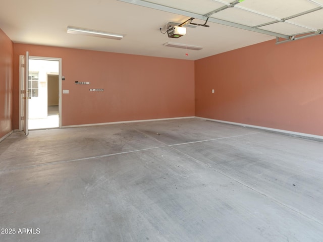 2826 E Tracy Ln Unit 3, Phoenix, AZ 85032 - garage with baseboards and a garage door opener