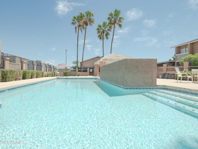 2826 E Tracy Ln Unit 3, Phoenix, AZ 85032 - community pool with fence and a patio area