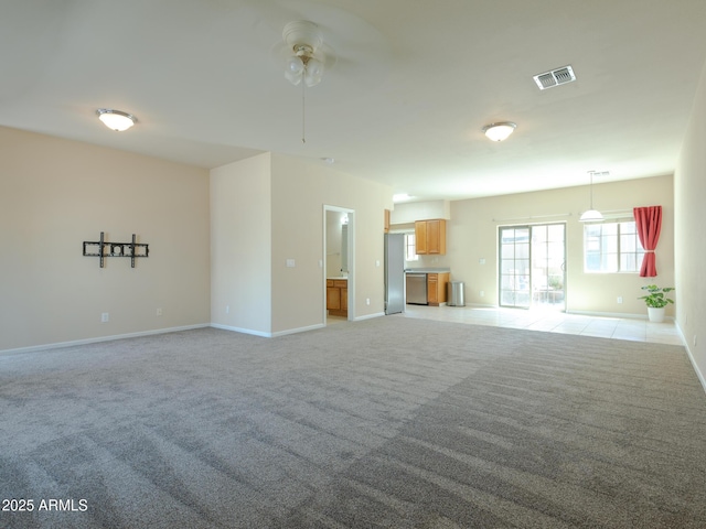 2826 E Tracy Ln Unit 3, Phoenix, AZ 85032 - unfurnished living room with a ceiling fan, light colored carpet, and baseboards