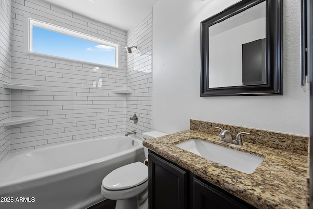 bathroom featuring toilet, bathing tub / shower combination, and vanity