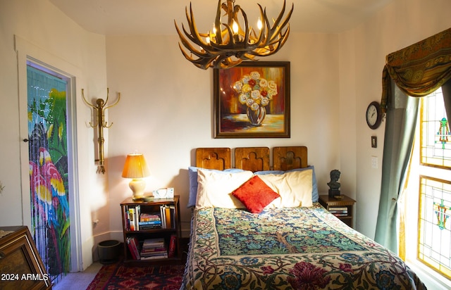 601 N Berry Ave, Winslow, AZ 86047 - carpeted bedroom featuring a notable chandelier